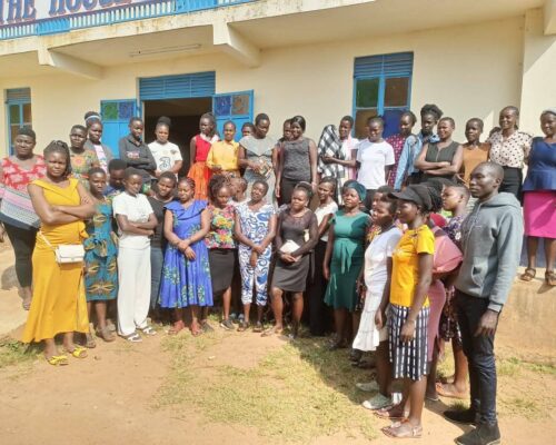 Women trained in Black Soldier Fly farming pose for a group photograph in Samia