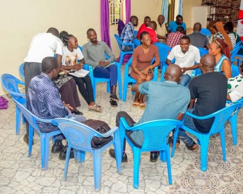 Participants in a circle during the Digital TrustLab Baraza in Busia