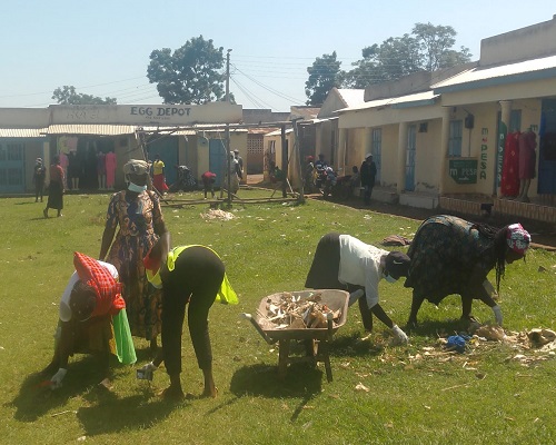 Youth volunteers clearing waste at Funyula Market